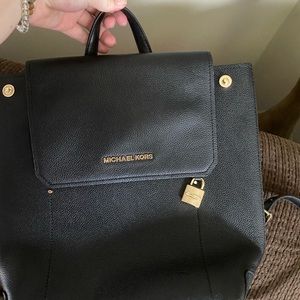 slightly used Michael Kors backpack
